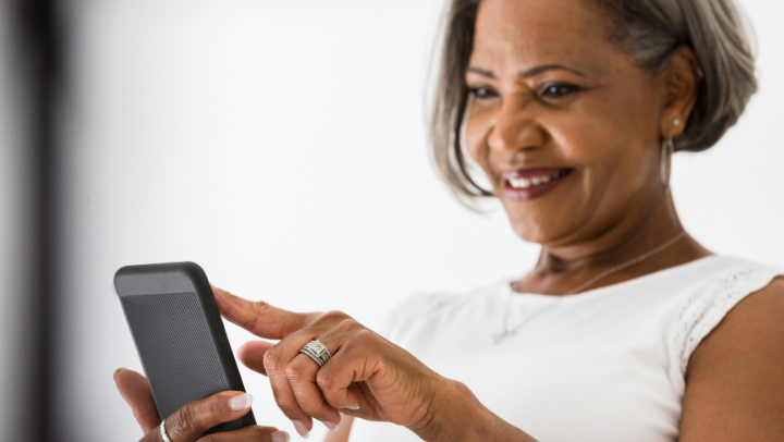 a senior lady watching her phone 